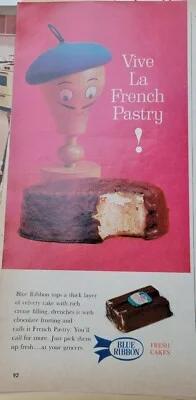 Vintage Blue Ribbon French Pastry chocolate cake with a cream filling and a cartoon character illustration.
