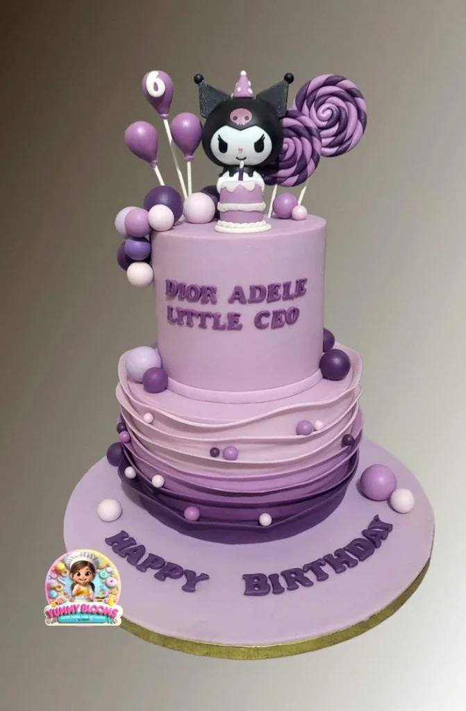 Two-tier purple Kuromi themed cake with ombre ruffles, fondant balloons, and lollipops.